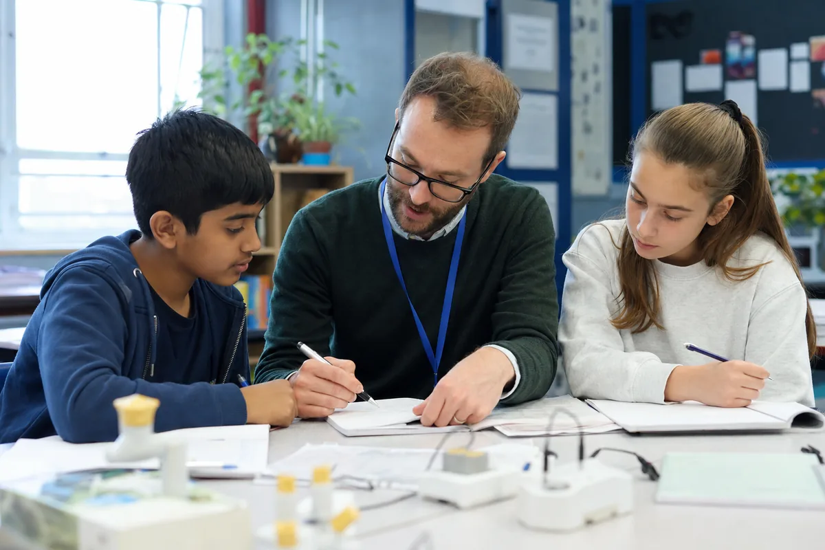 Key Stage 3 students learning with a tutor